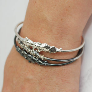 handchased and oxidised sterling silver bangles