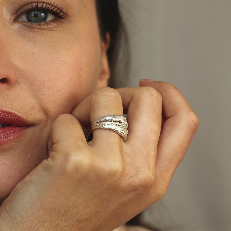 Model wearing extra wide statement ring - jewellery for under £150