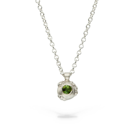 Delicate green tourmaline and silver pendant
